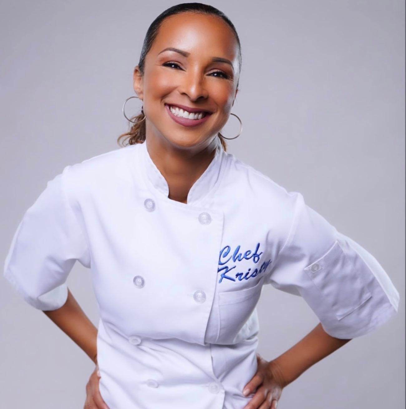 Chef Kristy Worrell smiling in her chef's jacket